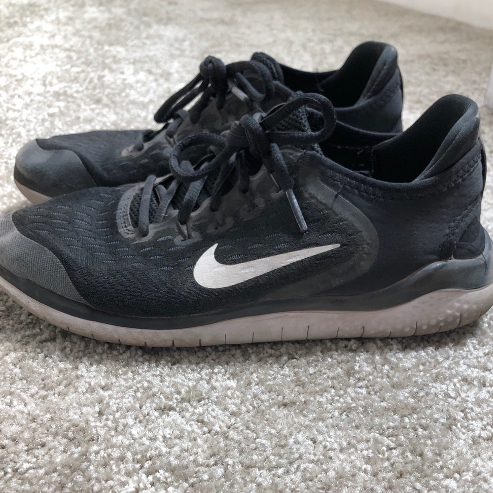 Black worn Nike free athletic shoes